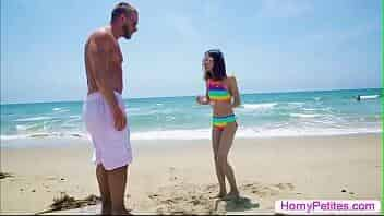 Skinny teen is playing sand on the beach and suddenly,a guy destroys her sandcastle.The guy apologizes and they go to her room.After that,she starts throating guys big cock passionately and in return the guy fucks her and cums on her face. video